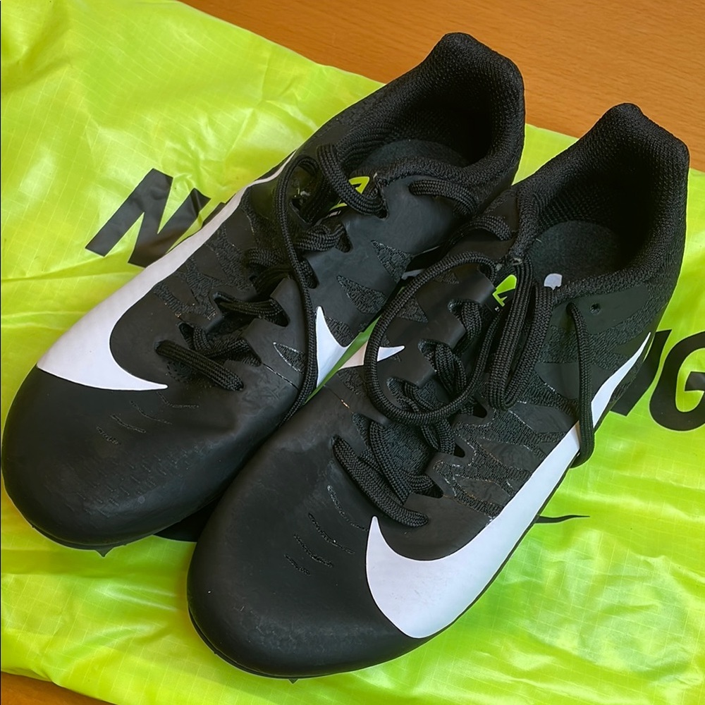 Nike Men's Black and White track spikes.